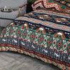 A close-up of a boho striped geometric duvet cover set featuring earthy tones and intricate patterns.