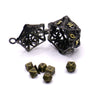 A set of black metal dice, including a large dodecahedron and several smaller dice, displayed on a white background.