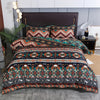 A patterned duvet cover set featuring geometric stripes in earthy tones of teal, orange, and brown on a bed.
