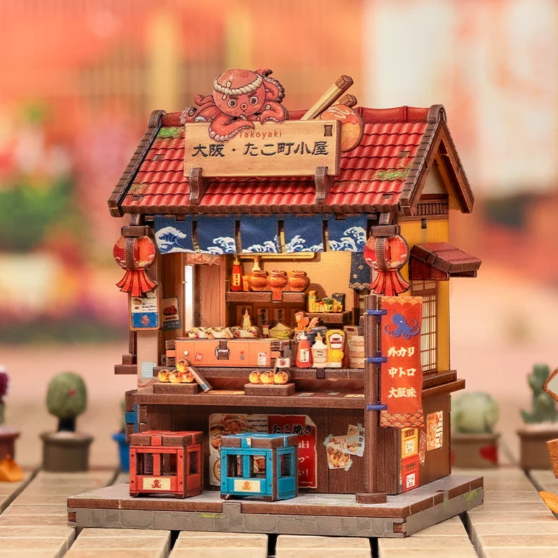 A detailed miniature kit of a Japanese street stall or book nook featuring a tiled roof and wooden facade.