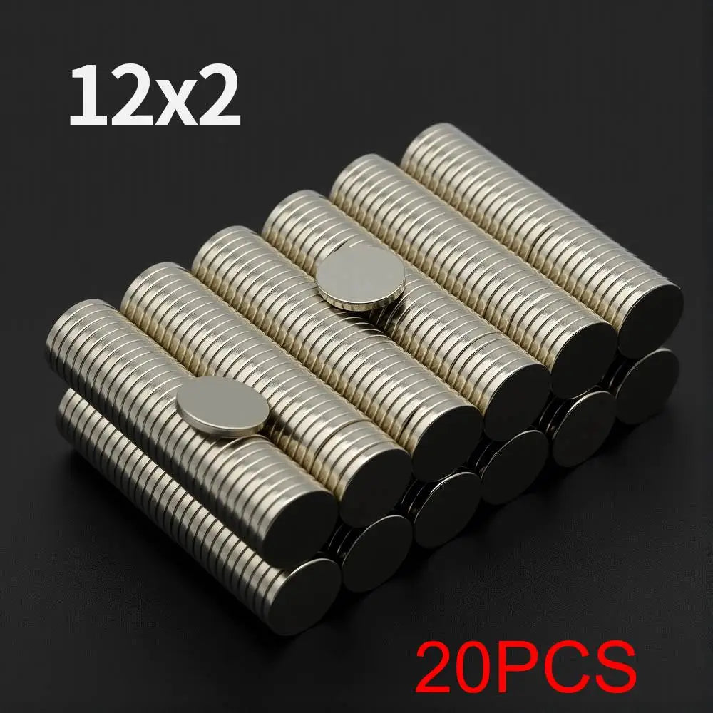 A pile of 20 pairs of 12x2 disc neodymium magnets in silver and black.