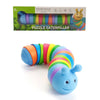 A blue articulated fidget slug toy with colorful, flexible rings, shown next to its packaging.