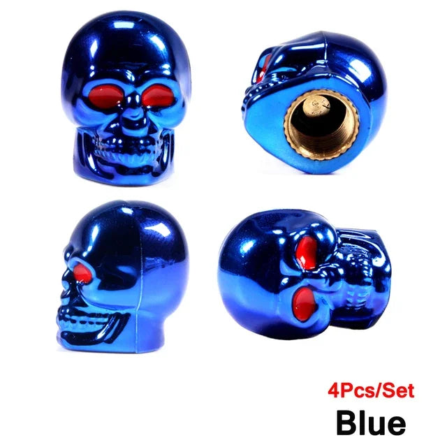 A set of four blue skull design tire valve stem caps.