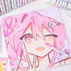 A close-up of a hand-drawn anime style face in pink and white, surrounded by acrylic paint markers.
