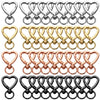 A collection of heart-shaped spring hook keychains in silver, gold, rose gold, and black.