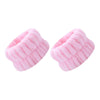 A pair of pink absorbent microfiber wrist washing bands or face-saving cuffs.