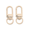 A pair of light beige alloy lobster clasp hooks for DIY jewelry making