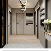 Modern pendant light fixture with an oval design hanging in a contemporary interior hallway.