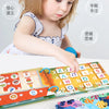 A toddler is interacting with a Montessori busy book featuring colorful matching games and letters.