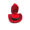 A red velvet cowboy hat jewelry storage box with a secure closure.