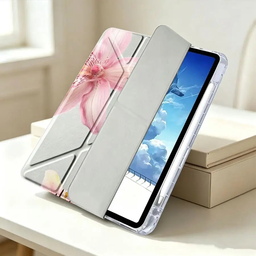 A clear silicone tablet case featuring a pink lily flower design and an integrated pen holder.