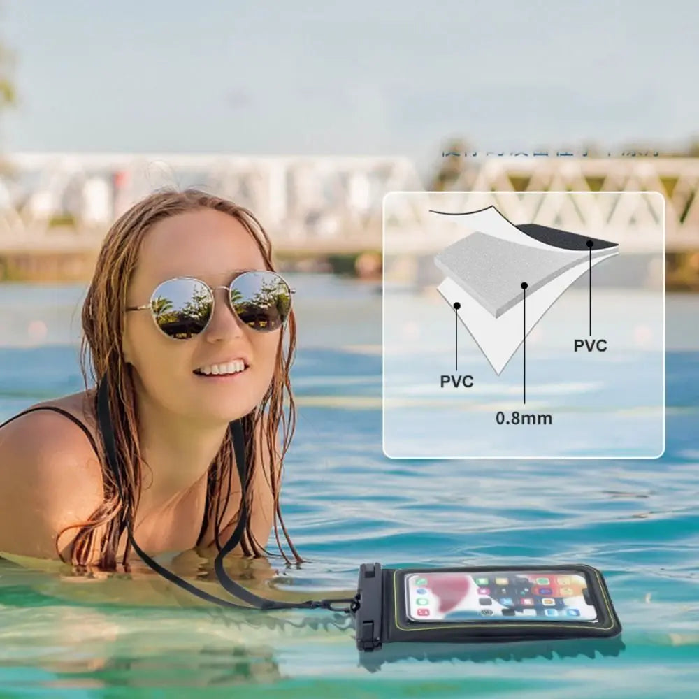 A woman wearing sunglasses is floating in water with a waterproof phone case visible nearby.