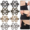 A collection of adjustable flower waist clips in silver, gold, and dark metal finishes for pants and jeans.