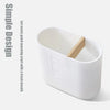 A white bamboo bathroom organizer set with a wooden lid and soap dispenser.