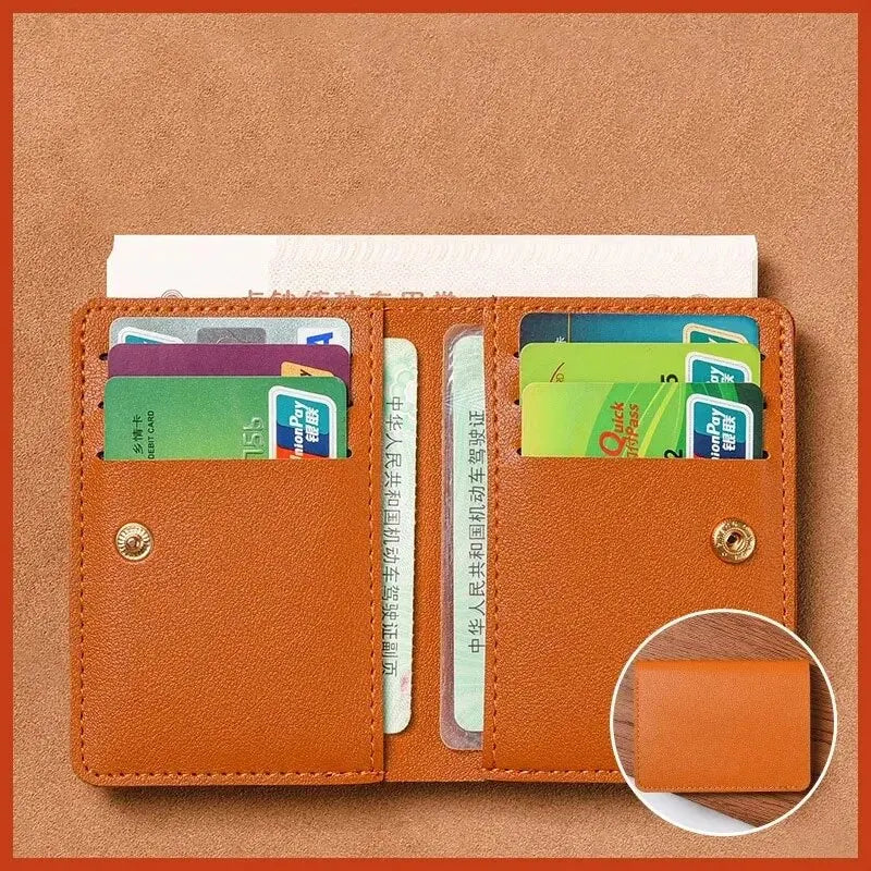An orange brown ultra-thin PU leather compact wallet holding several credit cards and an ID card.