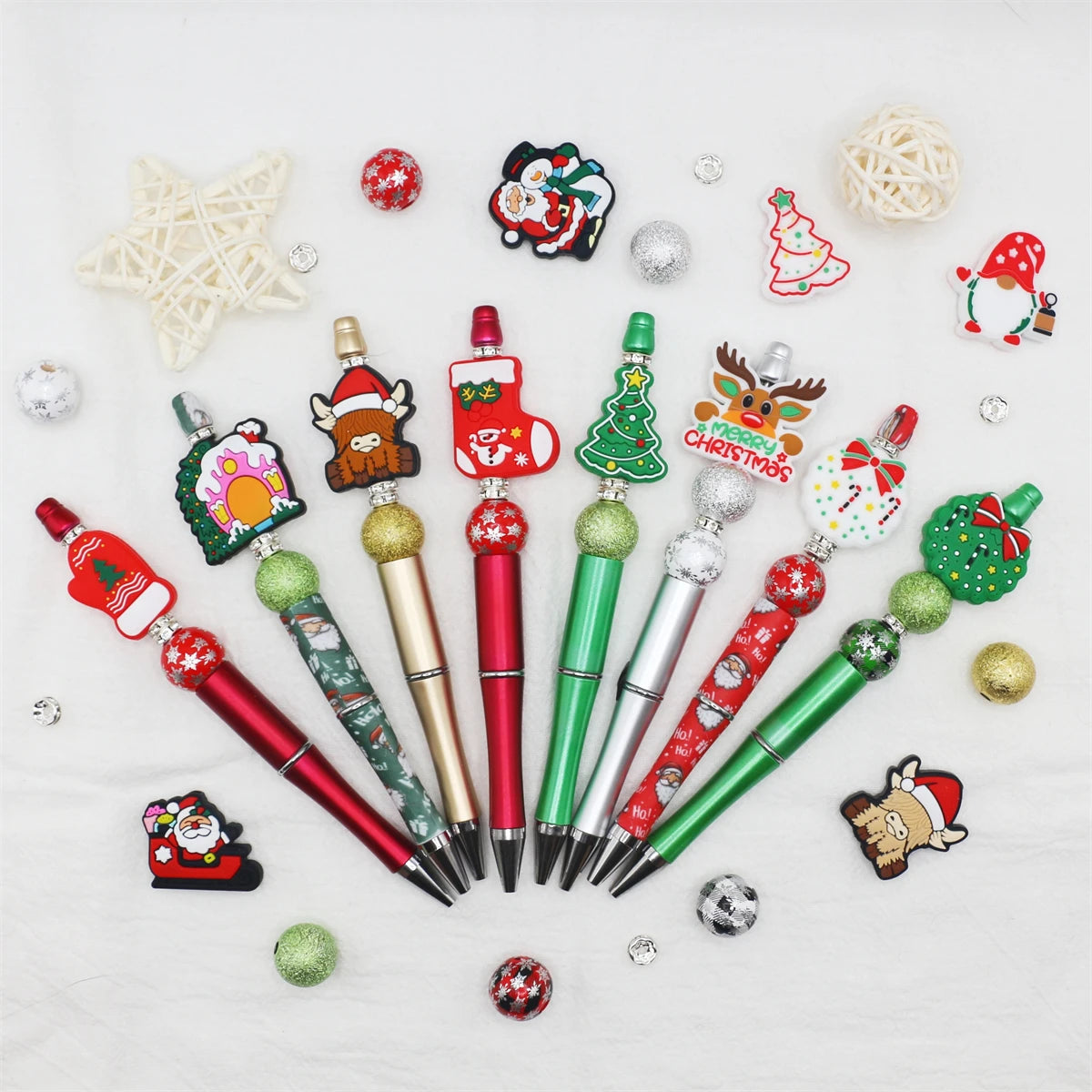 A DIY beaded ballpoint pen craft kit featuring various Christmas-themed beads and pens.