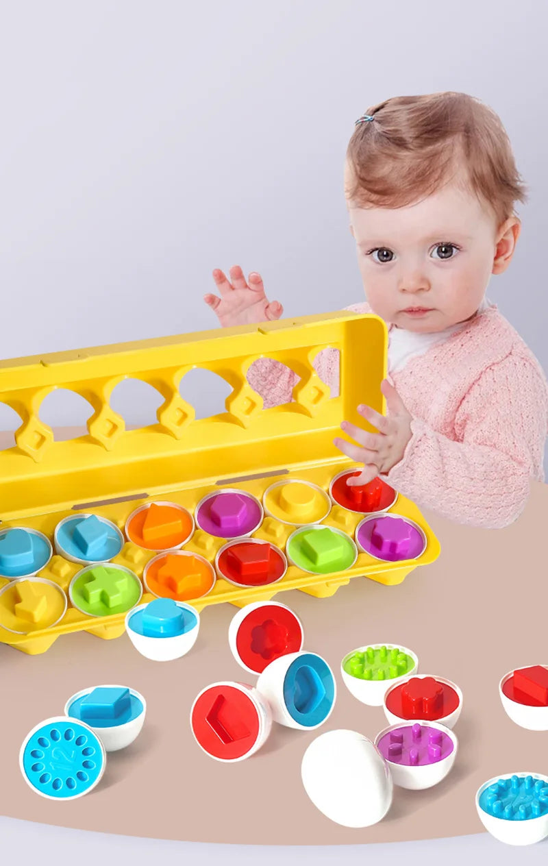 A baby is interacting with a yellow matching eggs Montessori toy that features various colored and shaped egg pieces.
