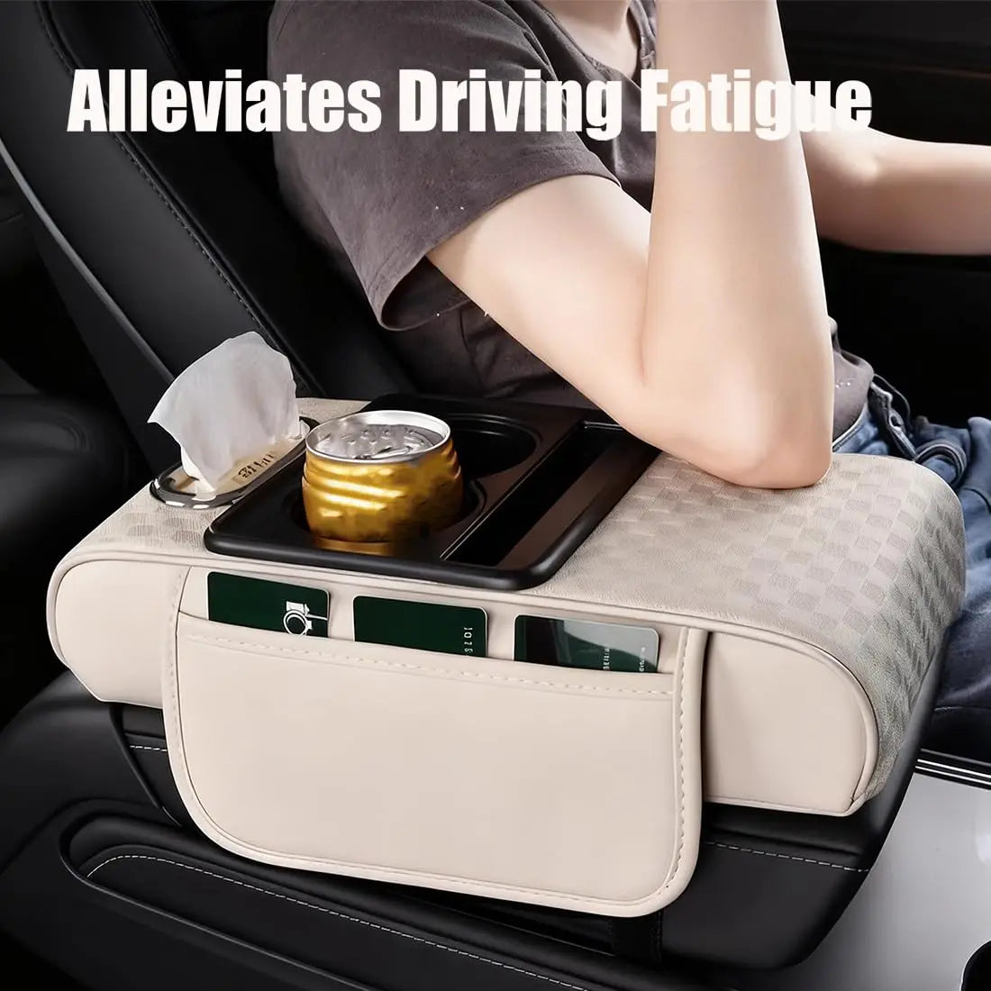 A beige car armrest cushion with a cup holder and storage compartment is shown in a vehicle interior.