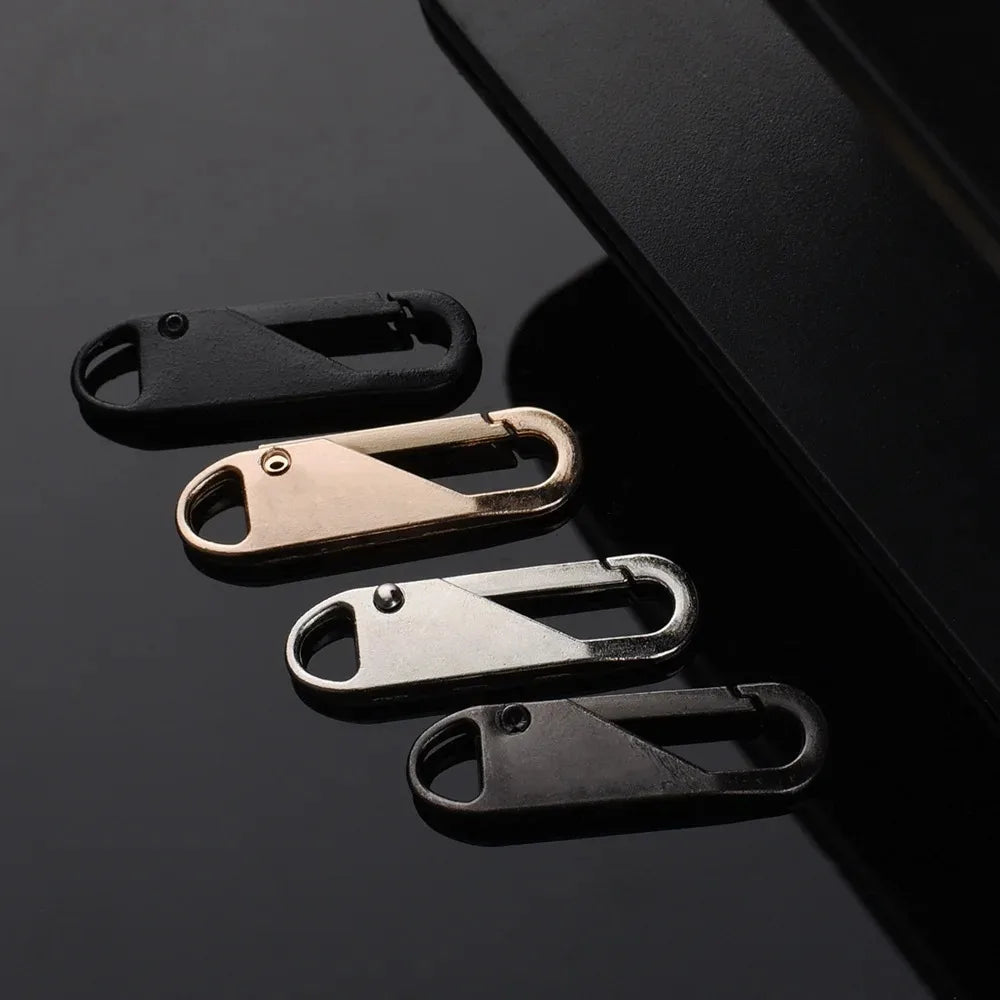 A set of eight metal zipper sliders in various finishes, including black and brass tones, displayed against a dark background