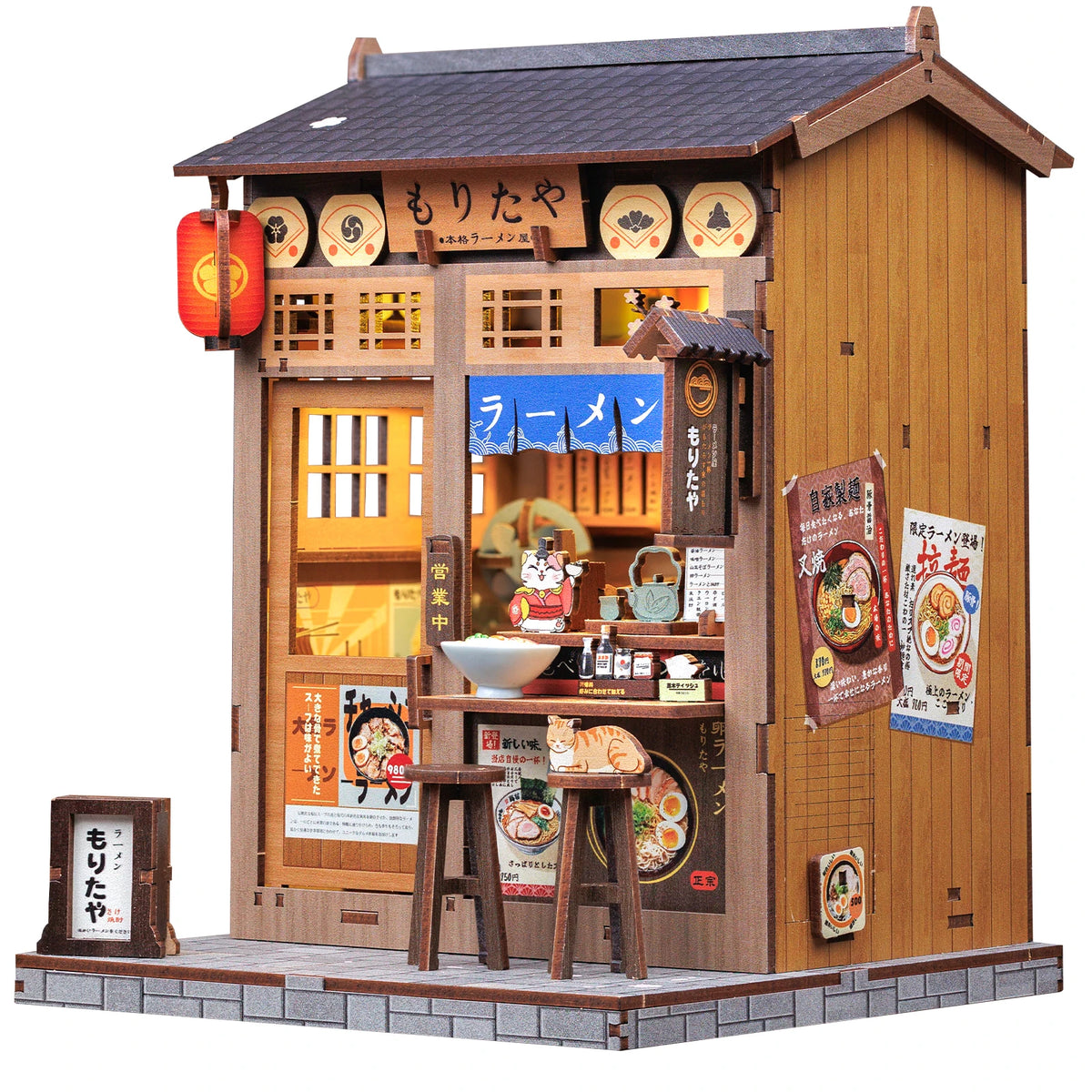 A miniature Japanese ramen shop building kit featuring wooden facade and lighting elements.