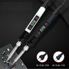 A soldering iron kit with a black handle, white body, and LCD temperature display, shown next to plugs for EU and US power.