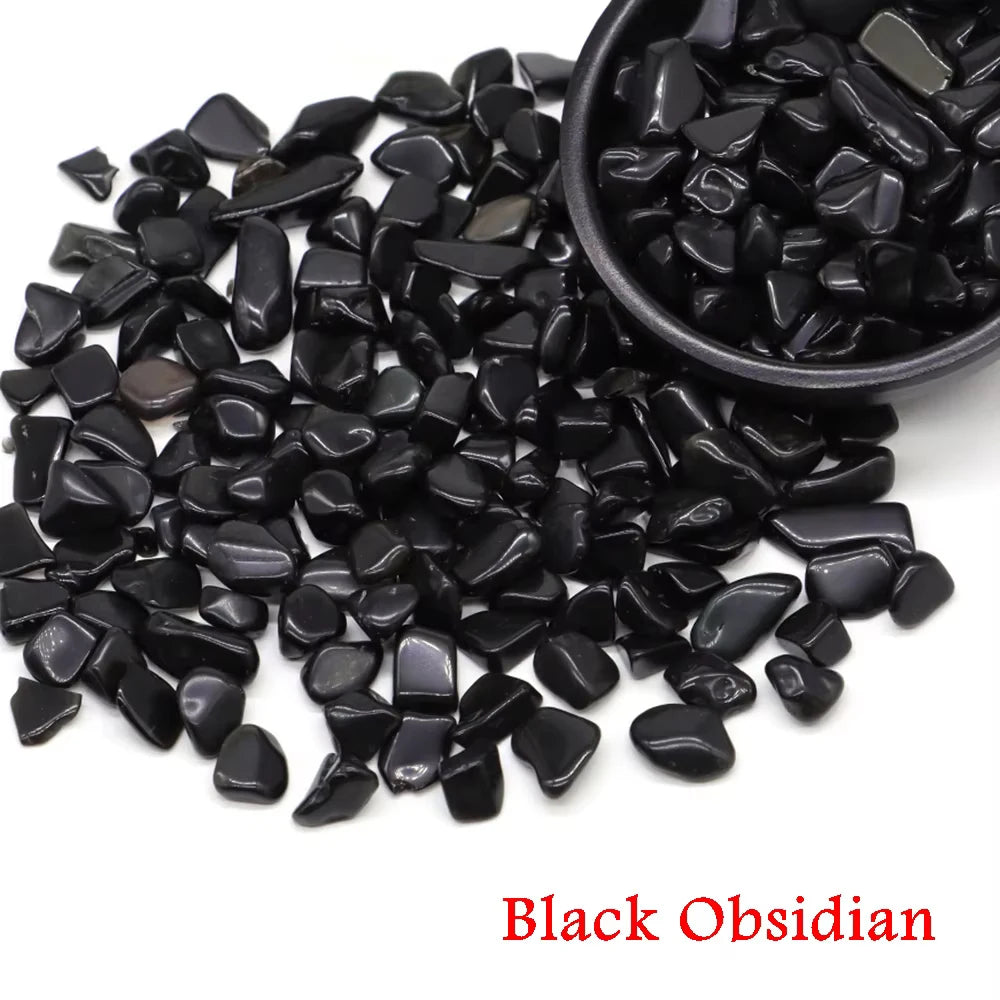 A pile of black obsidian crystal stone chips in a bowl.