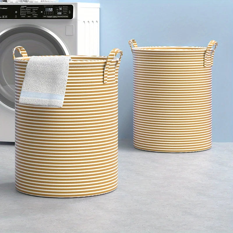 A striped yellow and white laundry basket with handles and a white towel resting inside, next to a washing machine.