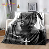 A black and white photograph of Eminem and 2Pac, featuring their faces in a close-up portrait on a throw blanket.