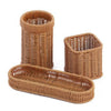 A set of seven handwoven wicker serving baskets in a natural brown color.