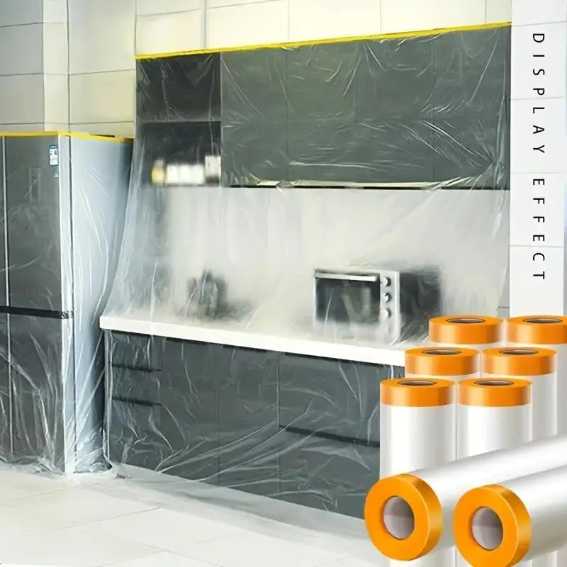 A kitchen cabinet and countertop are covered with clear plastic film for painting protection.