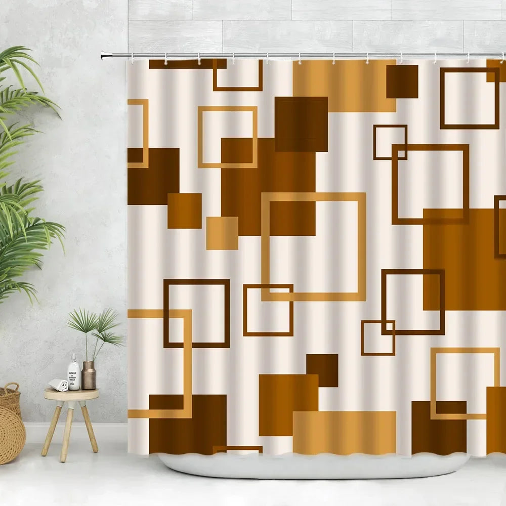A beige fabric shower curtain featuring a geometric pattern of brown and gold squares and rectangles.