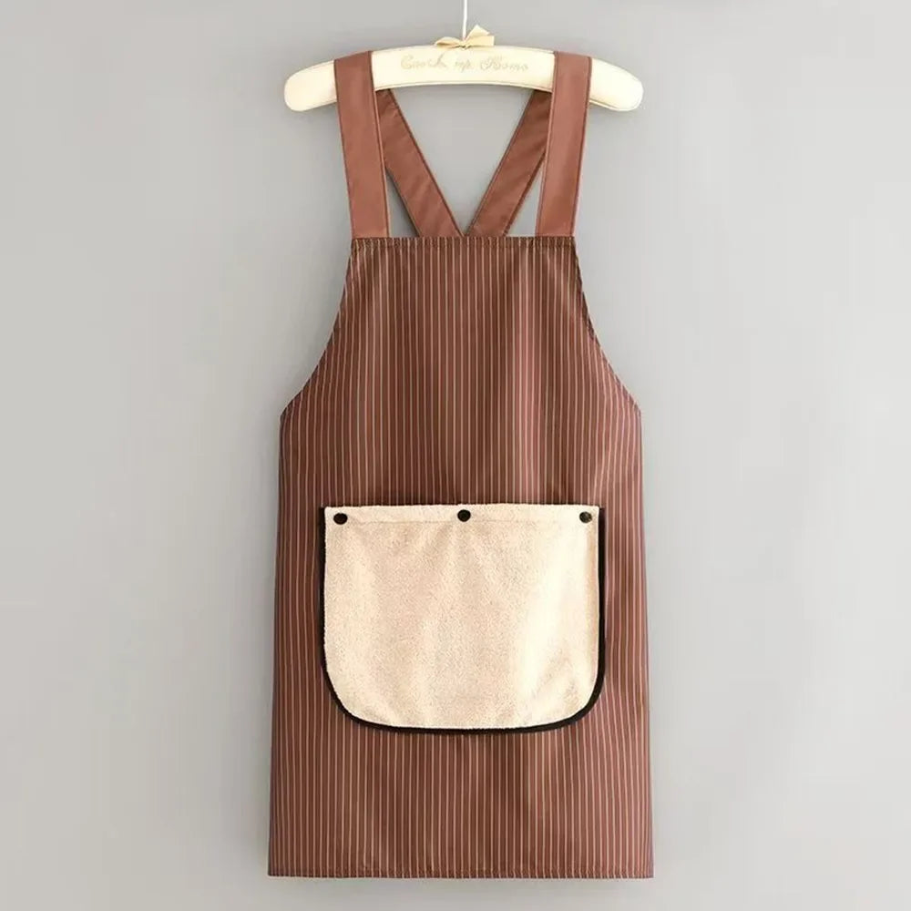 A brown striped kitchen apron with a removable beige towel pocket hanging on a wooden hanger.