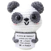 Handmade crochet panda doll with gray and white fur and an inspirational card