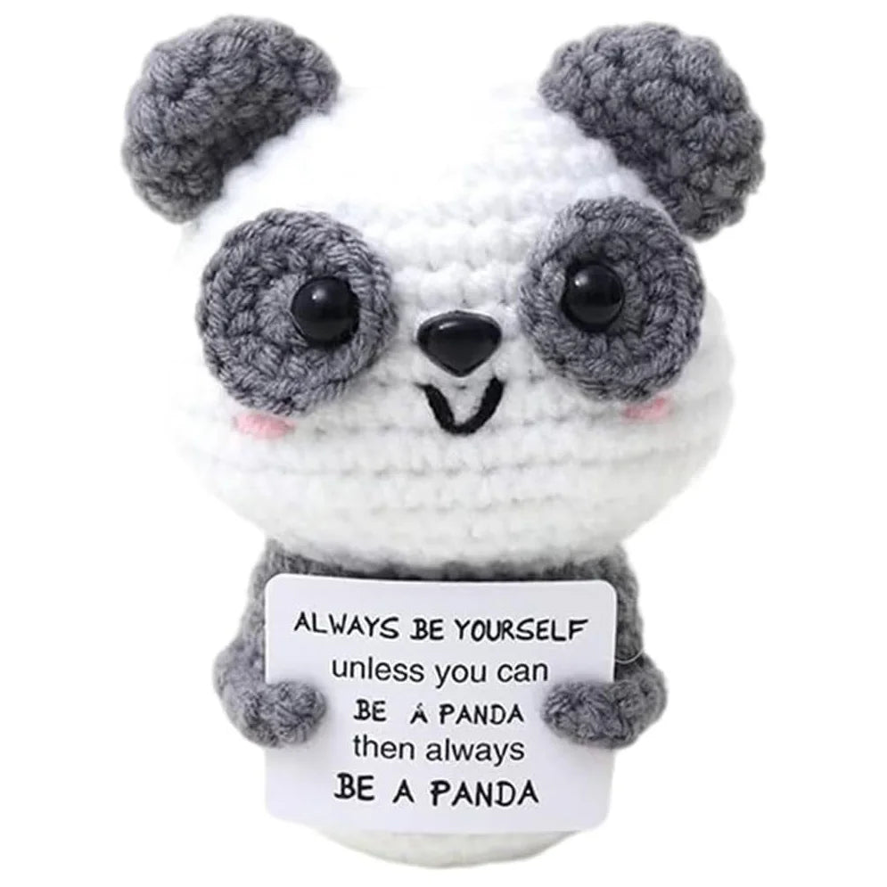 Handmade crochet panda doll with gray and white fur and an inspirational card