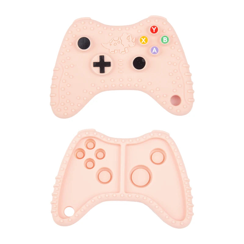 A pink silicone baby teether toy shaped like a remote control, featuring various letter and number buttons.