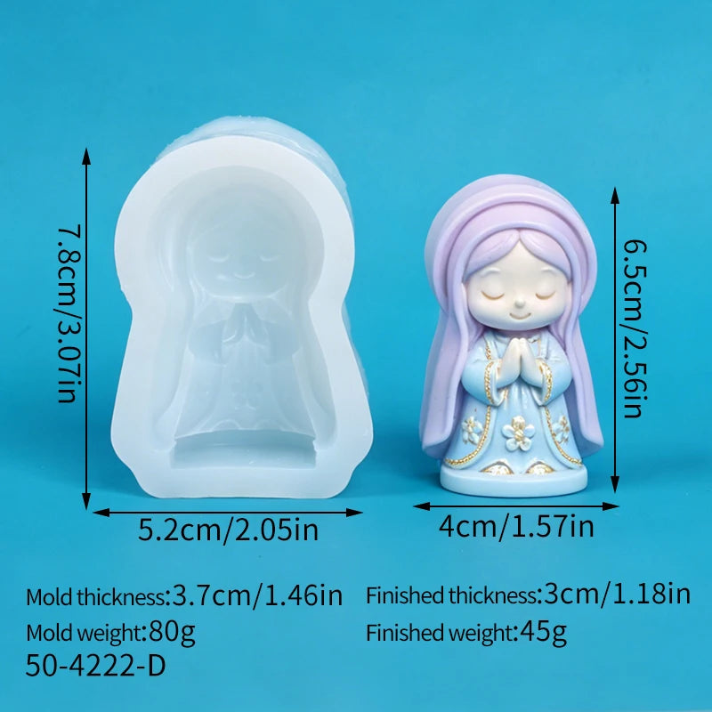 A finished silicone mold of a praying girl figure in light blue and purple tones, used for crafting.