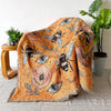 A bohemian jacquard woven throw blanket featuring an orange background with stylized bees and eyes.
