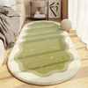 A light green plush decorative area rug with a white border placed on a wooden floor.