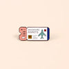 A vintage airline ticket enamel brooch featuring an adventure awaits design with a plane and heart symbols.