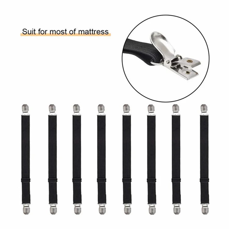 A set of four black adjustable elastic bed sheet corner straps with silver metal clasps.
