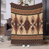 A beige and brown ethnic print flannel throw blanket featuring geometric patterns and fringe details.