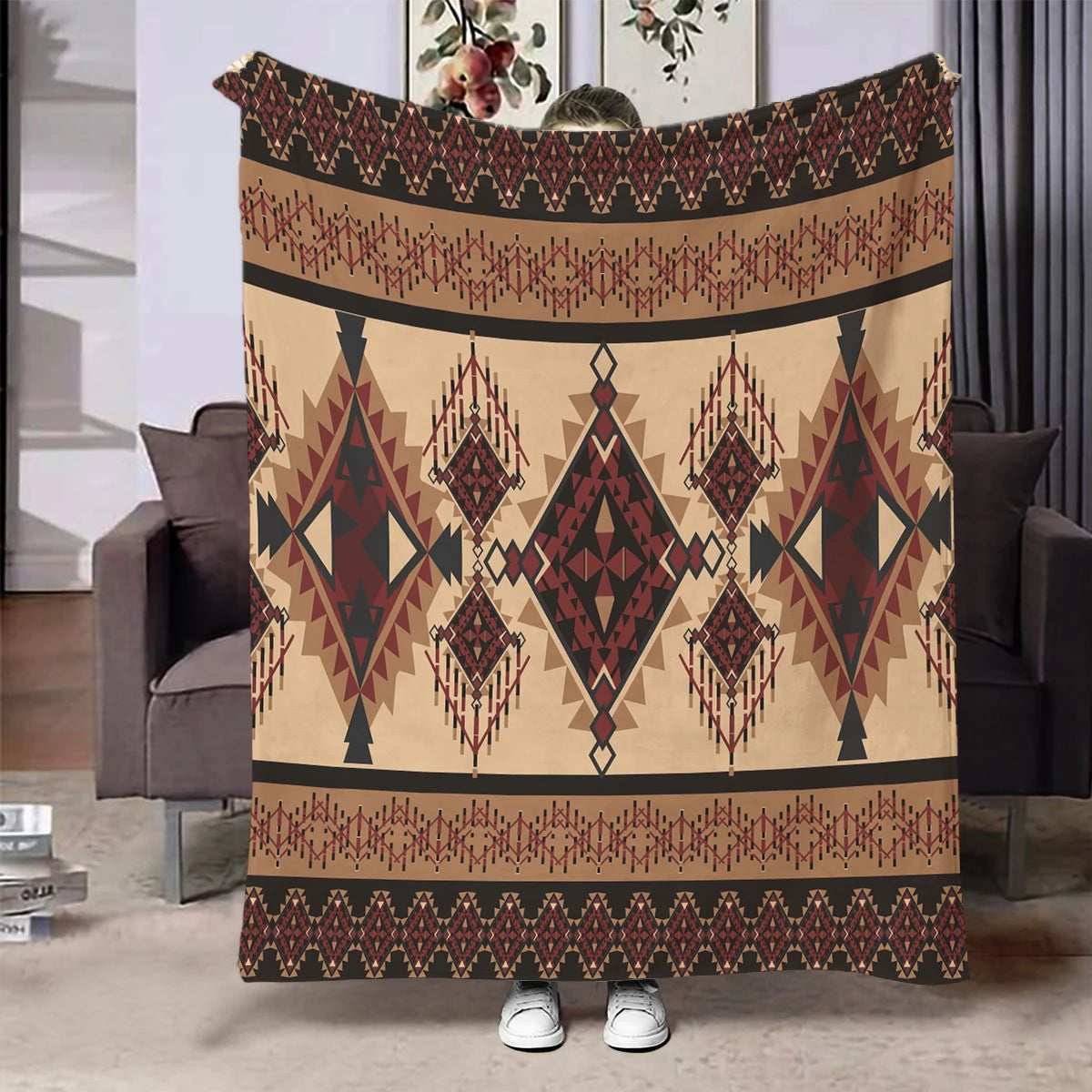 A beige and brown ethnic print flannel throw blanket featuring geometric patterns and fringe details.