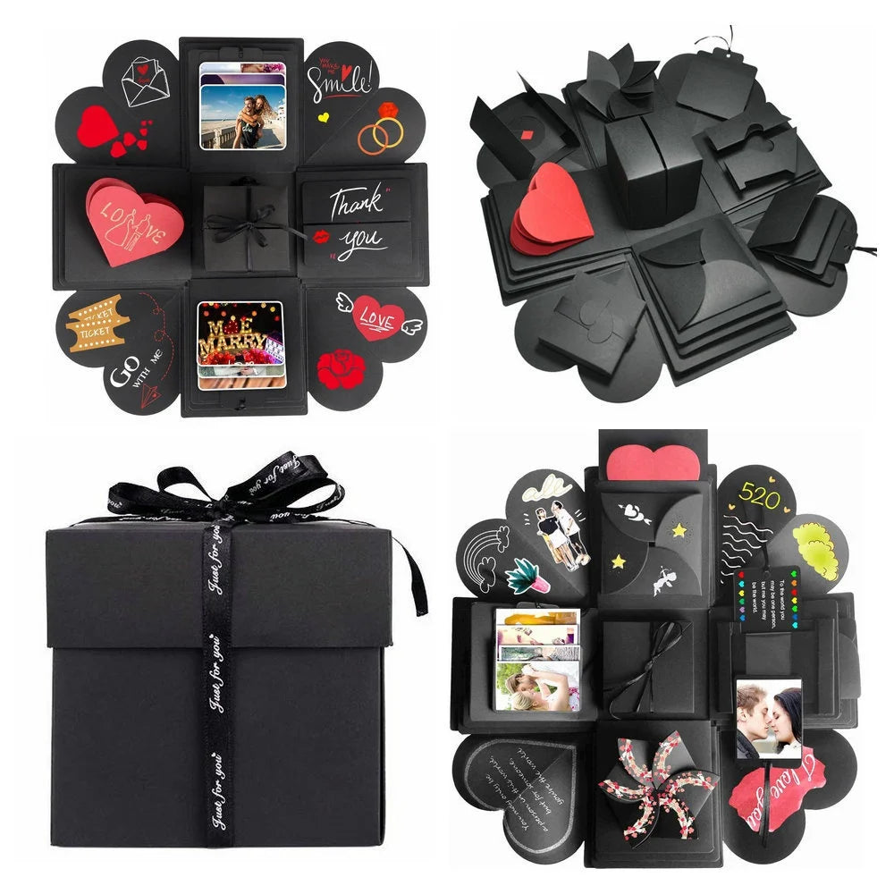 A black gift box with a lid featuring various photo-themed stickers and a decorative ribbon.
