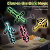 A collection of glow-in-the-dark transformable gemstone toys and keychains featuring black and neon green patterns.