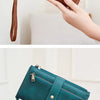 A brown leather wallet is shown open, displaying multiple card slots and a layered design.