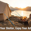 A person sits by a campfire enjoying the sunset while a tent is set up nearby.