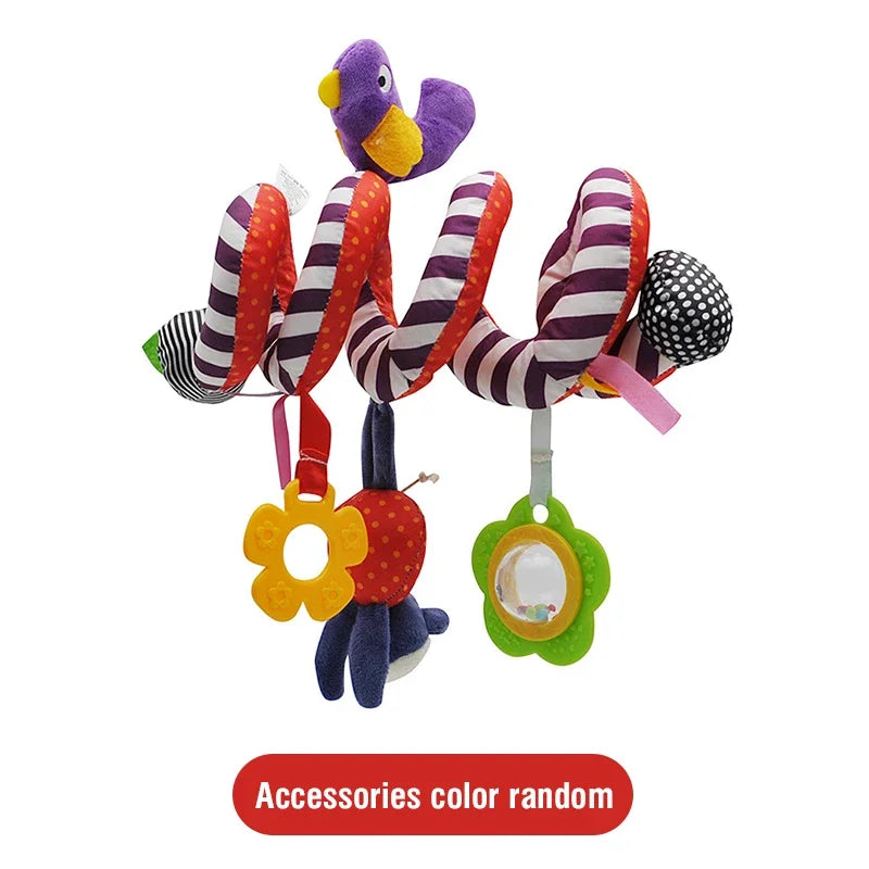 A set of colorful striped plush toys with pom-poms and a flower charm for hanging on a stroller or crib.