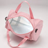A pink compact nylon gym bag with a clear window and adjustable strap.
