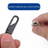 A close-up shot showing a black metal zipper slider and a silver replacement zipper slider being held by a hand.