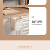 A white foldable hanging trash bin shown in use for office cabinet doors and kitchen cabinets.